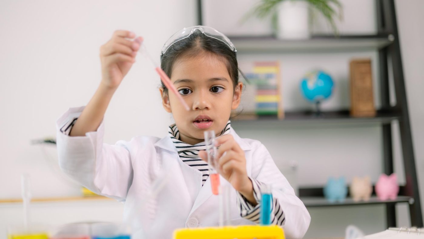child in chemistry kit
