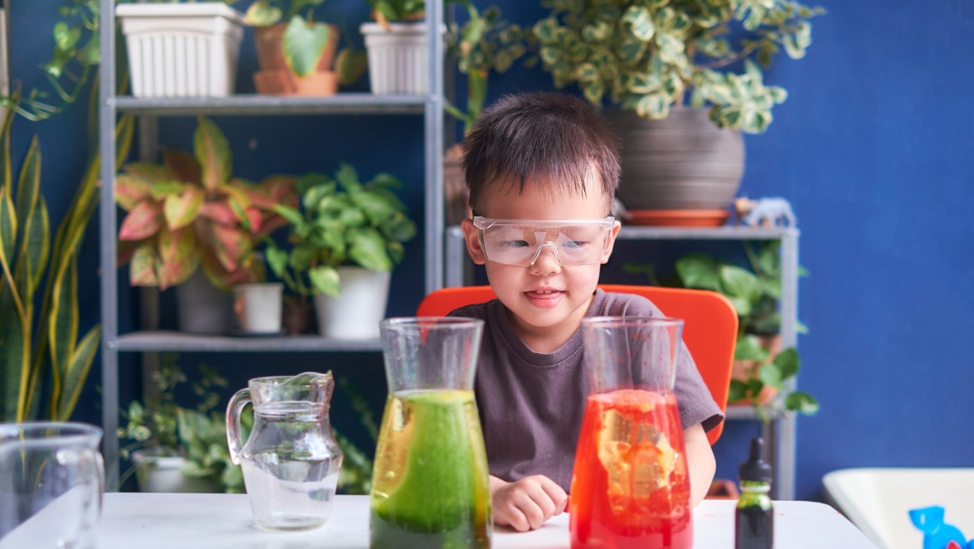 child doing science experiment