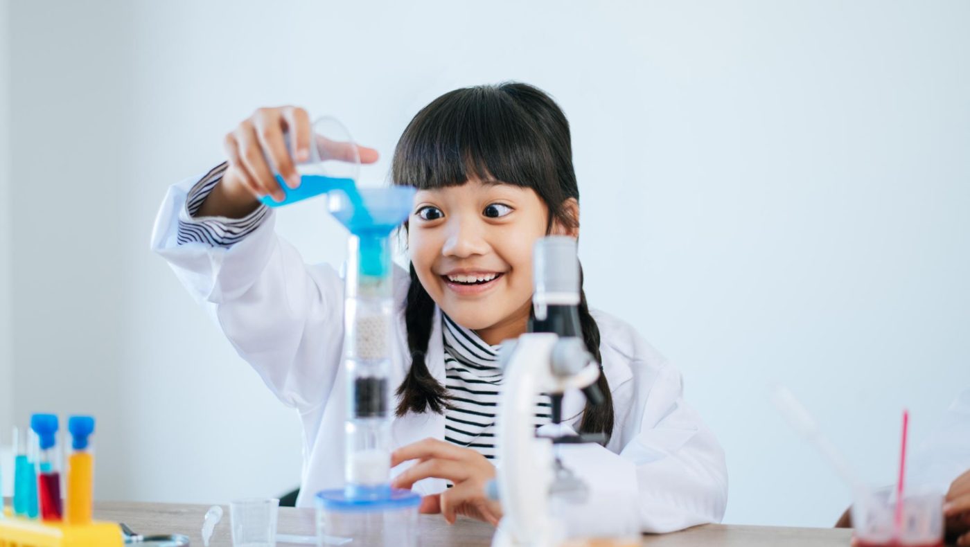 child studying science