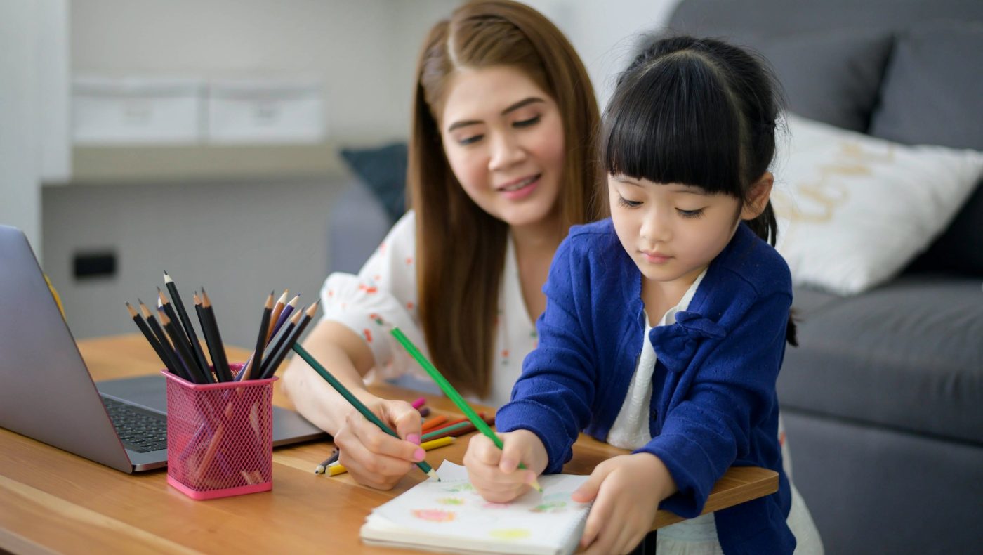 toddler studying with mom
