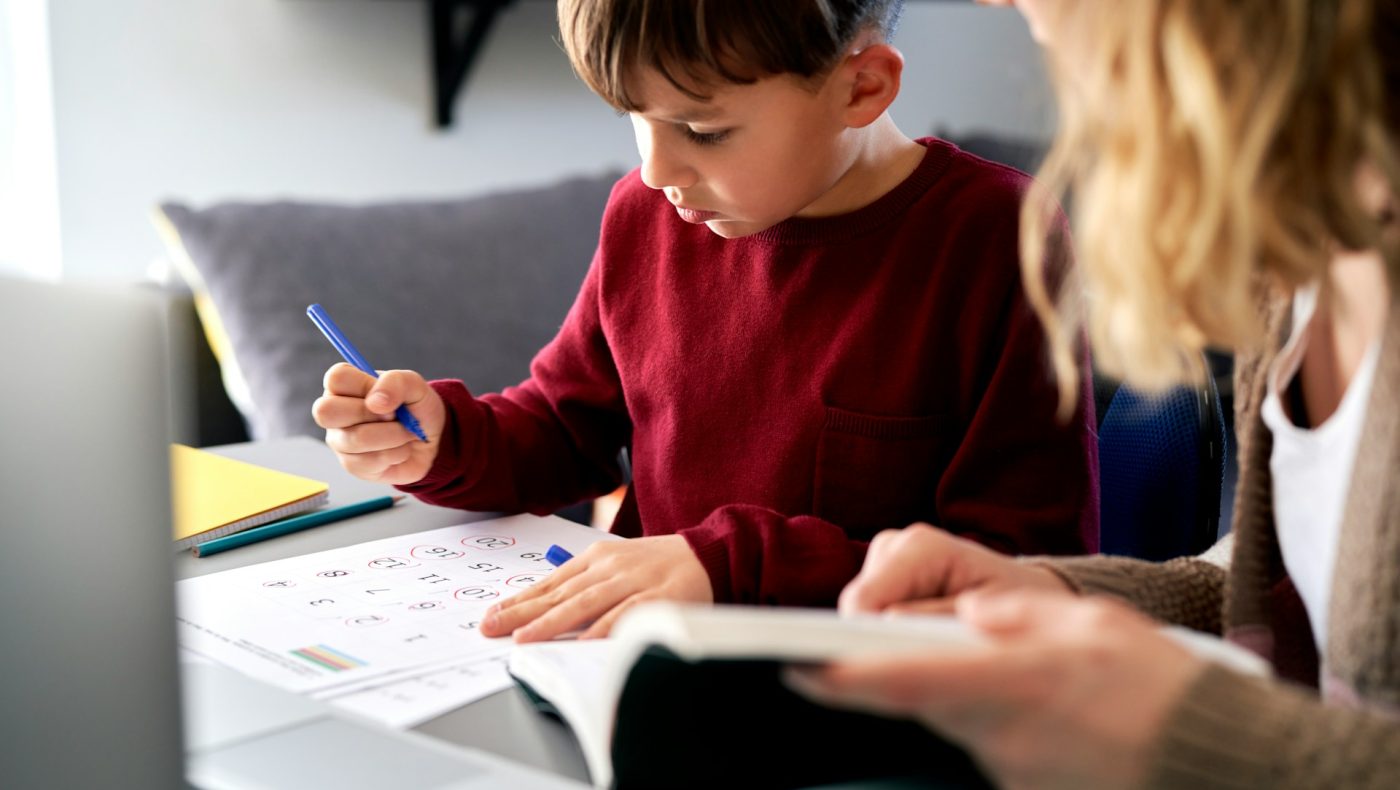 young boy studying math