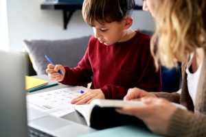 young boy studying math